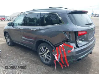 2017 Honda Pilot Touring with VIN 5FNYF6H92HB012090, listed as a IAAI auction lot 41882542 with 110,179 mi miles and . Bid and sale history available at DreamBid. Image 3.
