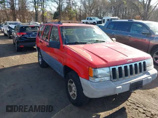 1997 Jeep Grand Cherokee Laredo with VIN 1J4GZ58S0VC550242, listed as a IAAI auction lot 41032114 with 185,307 mi miles. Bid and sale history available at carsss.com. Image 1.