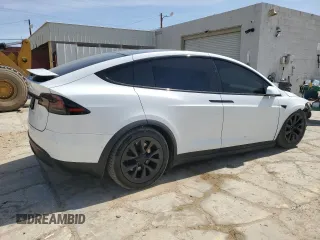 2022 Tesla Model X with VIN 7SAXCBE52NF362994, listed as a Copart auction lot 49850475 with 55,506 mi miles and Salvage Title. Bid and sale history available at DreamBid. Image 3.