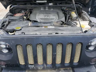 2012 Jeep Wrangler Unlimited Sport z VIN 1C4BJWDG7CL208265, wystawiony jako Copart lot #56101095 z przebiegiem 141 527 mil mil oraz Szkoda całkowita • Salvage title. Historia ofert i sprzedaży dostępna na DreamBid. Obrazek 11.