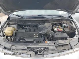2014 Mazda CX-9 Touring с VIN JM3TB2CA2E0431879, выставлен на аукционе Copart как лот 64778845 с пробегом 145 476 миль миль и Чистый • Clean title. История ставок и продаж доступна на DreamBid. Изображение 12.