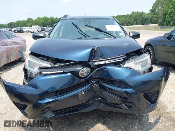 2017 Toyota RAV4 LE with VIN JTMBFREV5HJ173180, listed as a IAAI auction lot 42402753 with 97,917 mi miles and . Bid and sale history available at DreamBid. Image 12.