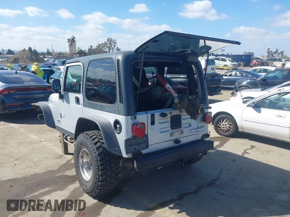 2004 Jeep Wrangler Rubicon with VIN 1J4FA69S94P701660, listed as a IAAI auction lot 41699554 with 74,640 mi miles. Bid and sale history available at carsss.com. Image 3.