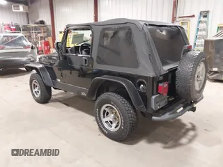 2002 Jeep Wrangler Sport with VIN 1J4FA49S02P704741, listed as a IAAI auction lot 41759558 with 191,126 mi miles. Bid and sale history available at carsss.com. Image 3.