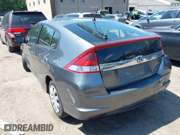 2013 Honda Insight with VIN JHMZE2H31DS002352, listed as a IAAI auction lot 42551515 with 148,393 mi miles and . Bid and sale history available at DreamBid. Image 3.