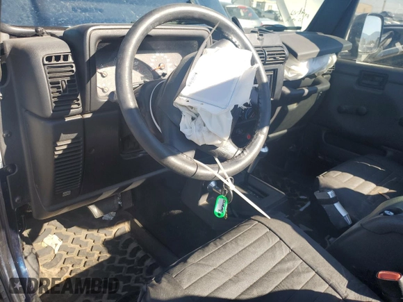 2005 Jeep Wrangler SE with VIN 1J4FA29S65P330905, listed as a Copart auction lot 71633134 with 77,598 mi miles and Salvage Title. Bid and sale history available at carsss.com. Image 8.