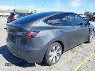 2022 Tesla Model Y Long Range with VIN 7SAYGAEEXNF381389, listed as a IAAI auction lot 41613075 with 52,800 mi miles and . Bid and sale history available at carsss.com. Image 4.
