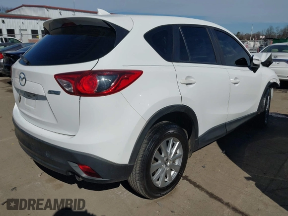 2016 Mazda CX-5 Sport with VIN JM3KE2BY9G0890587, listed as a IAAI auction lot 41685344 with 91,190 mi miles. Bid and sale history available at carsss.com. Image 4.