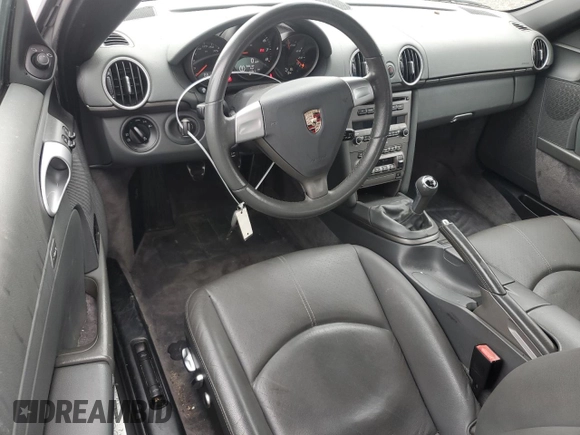 2007 Porsche Boxster z VIN WP0CA29857U711677, wystawiony jako Copart lot #79859924 z przebiegiem 83 123 mil mil oraz Szkoda całkowita • Salvage title. Historia ofert i sprzedaży dostępna na DreamBid. Obrazek 8.