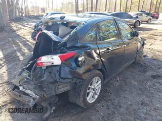 2018 Ford Focus SE with VIN 1FADP3F20JL218002, listed as a IAAI auction lot 41636952 with 90,059 mi miles and . Bid and sale history available at carsss.com. Image 4.