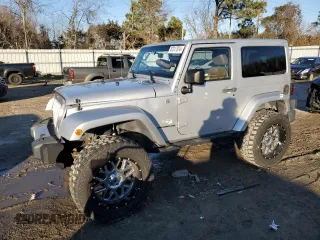 2011 Jeep Wrangler Sahara with VIN 1J4GA5D14BL628876, listed as a Copart auction lot 87317374 with 84,179 mi miles and Salvage Title. Bid and sale history available at carsss.com. Image 1.