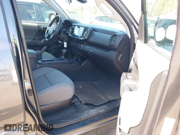 2023 Toyota Tacoma SR with VIN 3TMCZ5AN0PM614127, listed as a IAAI auction lot 41974924 with 12,674 mi miles and . Bid and sale history available at DreamBid. Image 5.