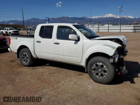 2018 Nissan Frontier Pro-4X with VIN 1N6AD0EV1JN715111, listed as a Copart auction lot 54012255 with 127,409 mi miles and Salvage title. Bid and sale history available at DreamBid. Image 4.