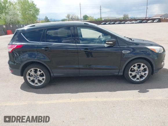2014 Ford Escape Titanium with VIN 1FMCU9JX2EUB66579, listed as a IAAI auction lot 42171374 with 131,485 mi miles. Bid and sale history available at carsss.com. Image 13.