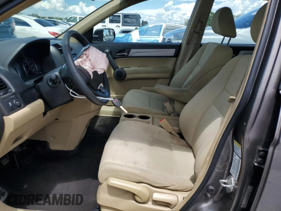 2010 Honda CR-V LX with VIN 5J6RE4H34AL057648, listed as a Copart auction lot 62679515 with 103,047 mi miles and Salvage title. Bid and sale history available at DreamBid. Image 7.