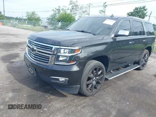 2015 Chevrolet Tahoe LTZ with VIN 1GNSCCKC5FR103676, listed as a IAAI auction lot 42456913 with 214,009 mi miles and . Bid and sale history available at DreamBid. Image 16.