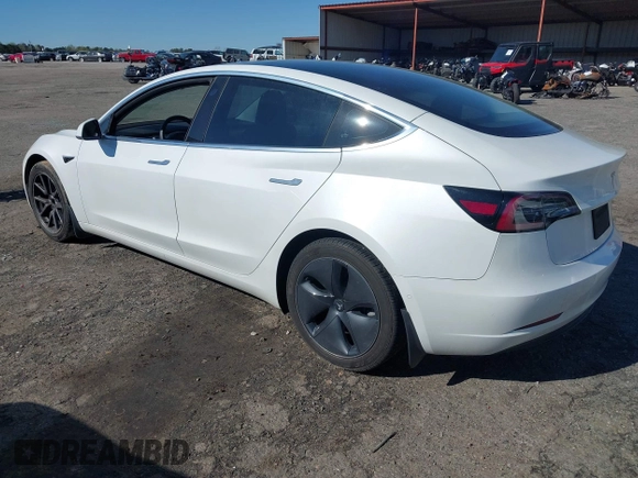 2020 Tesla Model 3 Standard Range Plus with VIN 5YJ3E1EA7LF797150, listed as a IAAI auction lot 41869088 with 75,708 mi miles and . Bid and sale history available at carsss.com. Image 3.