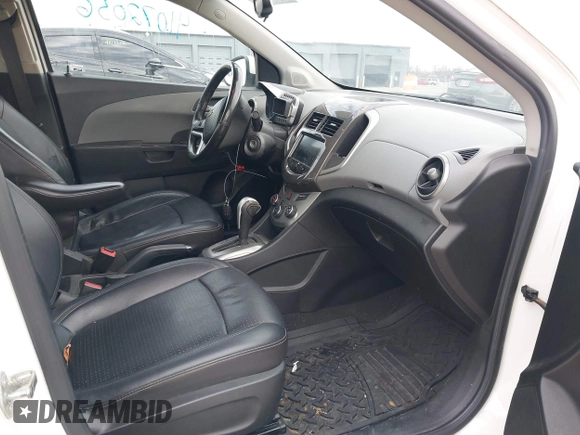 2014 Chevrolet Sonic LTZ with VIN 1G1JE5SH3E4133088, listed as a IAAI auction lot 41072056 with 143,855 mi miles. Bid and sale history available at carsss.com. Image 5.