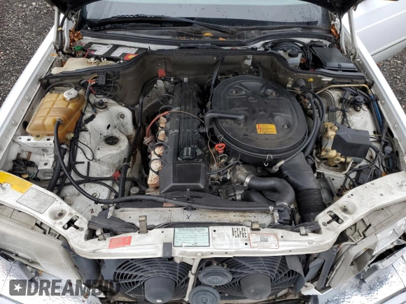1990 Mercedes-Benz 300 with VIN WDBCA25D9LA550909, listed as a Copart auction lot 82717124 with 221,701 mi miles and Salvage Title. Bid and sale history available at DreamBid. Image 11.