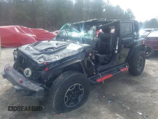 2015 Jeep Wrangler Unlimited Rubicon z VIN 1C4BJWFG7FL711036, wystawiony jako IAAI lot #41604648 z przebiegiem 167 678 mil mil oraz . Historia ofert i sprzedaży dostępna na DreamBid. Obrazek 2.