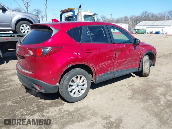 2014 Mazda CX-5 Touring with VIN JM3KE2CY2E0374440, listed as a IAAI auction lot 41634144 with 106,145 mi miles and . Bid and sale history available at DreamBid. Image 4.