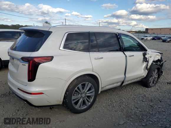 2020 Cadillac XT6 FWD Premium Luxury with VIN 1GYKPCRS2LZ138465, listed as a Copart auction lot 76114034 with 57,353 mi miles and Salvage Title. Bid and sale history available at carsss.com. Image 3.