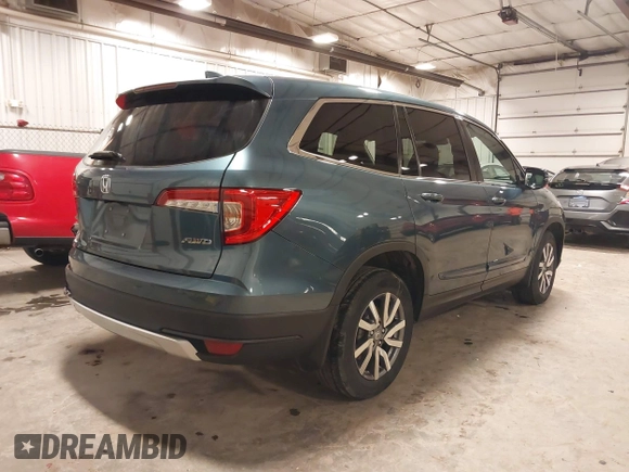 2019 Honda Pilot EX-L with VIN 5FNYF6H5XKB094879, listed as a IAAI auction lot 41265415 with 58,700 mi miles and . Bid and sale history available at DreamBid. Image 4.