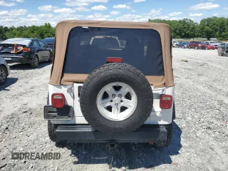 2004 Jeep Wrangler Sport with VIN 1J4FA49S94P751849, listed as a Copart auction lot 55519445 with 139,854 mi miles and Salvage title. Bid and sale history available at DreamBid. Image 6.