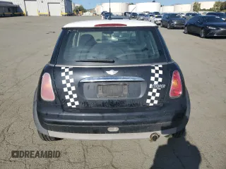 2004 MINI Hardtop with VIN WMWRC33464TJ62893, listed as a Copart auction lot 51905565 with 141,958 mi miles and Salvage Title. Bid and sale history available at DreamBid. Image 6.