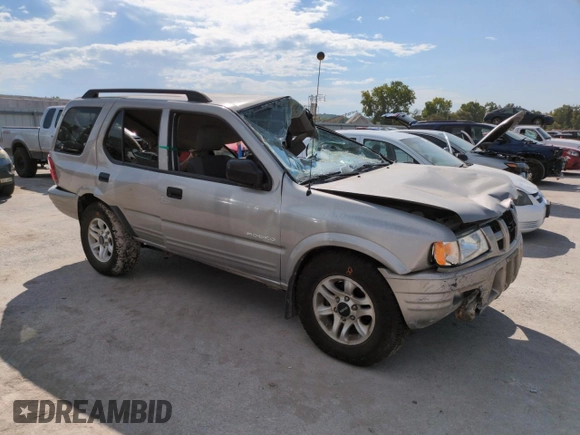 2004 Isuzu Rodeo S with VIN 4S2DM58W144316571, listed as a Copart auction lot 72086554 with Not Provided miles and Salvage Title. Bid and sale history available at DreamBid. Image 4.