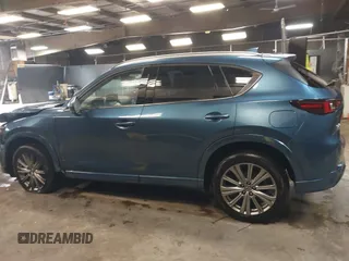 2023 Mazda CX-5 Signature with VIN JM3KFBXY4P0120187, listed as a IAAI auction lot 41706264 with 9,402 mi miles and . Bid and sale history available at carsss.com. Image 14.