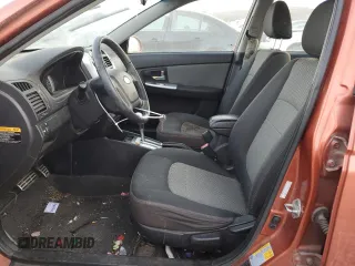 2009 Kia Spectra SX with VIN KNAFE221095026589, listed as a Copart auction lot 45005514 with 203,779 mi miles and Salvage Title. Bid and sale history available at carsss.com. Image 7.