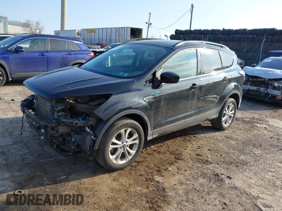 2018 Ford Escape SE z VIN 1FMCU9GD9JUC25456, wystawiony jako IAAI lot #41721436 z przebiegiem 55 642 mil mil oraz . Historia ofert i sprzedaży dostępna na DreamBid. Obrazek 18.