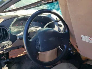 1999 Ford Econoline Passenger XL with VIN 1FBSS31L0XHB12679, listed as a Copart auction lot 74257504 with 136,821 mi miles and Salvage Title. Bid and sale history available at DreamBid. Image 8.
