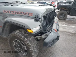 2022 Jeep Gladiator Mojave z VIN 1C6JJTEG8NL130971, wystawiony jako IAAI lot #41163074 z przebiegiem 47 142 mil mil oraz . Historia ofert i sprzedaży dostępna na DreamBid. Obrazek 19.