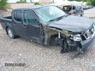 2015 Nissan Frontier SL with VIN 1N6AD0EV1FN764719, listed as a IAAI auction lot 42512771 with 104,572 mi miles and . Bid and sale history available at DreamBid. Image 6.