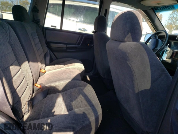 1998 Jeep Grand Cherokee Laredo with VIN 1J4GZ58S8WC167716, listed as a Copart auction lot 76477694 with 167,519 mi miles and Salvage Title. Bid and sale history available at carsss.com. Image 11.