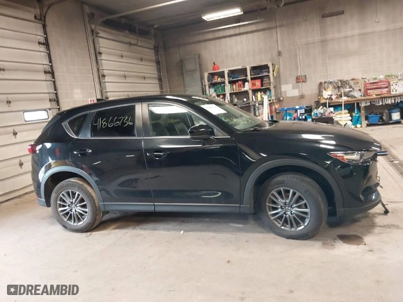 2019 Mazda CX-5 Touring with VIN JM3KFACM7K1568732, listed as a IAAI auction lot 41866736 with 50,753 mi miles. Bid and sale history available at carsss.com. Image 13.