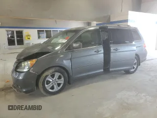2010 Honda Odyssey Touring with VIN 5FNRL3H91AB113770, listed as a Copart auction lot 61893115 with 155,776 mi miles and Salvage title. Bid and sale history available at DreamBid. Image 1.