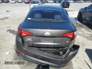 2013 Kia Optima LX z VIN 5XXGM4A74DG197071, wystawiony jako Copart lot #54780495 z przebiegiem 259 830 mil mil oraz Szkoda całkowita • Salvage title. Historia ofert i sprzedaży dostępna na DreamBid. Obrazek 6.