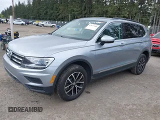 2021 Volkswagen Tiguan SE with VIN 3VV3B7AX0MM008809, listed as a IAAI auction lot 42077986 with 70,780 mi miles and . Bid and sale history available at DreamBid. Image 2.