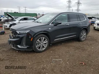 2022 Cadillac XT6 Premium Luxury z VIN 1GYKPFRS9NZ103281, wystawiony jako Copart lot #55118485 z przebiegiem 52 413 mil mil oraz Szkoda całkowita • Salvage title. Historia ofert i sprzedaży dostępna na DreamBid. Obrazek 1.