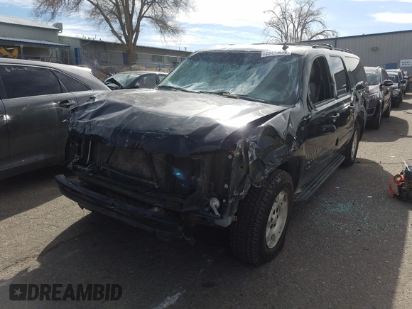 2012 Chevrolet Suburban LT with VIN 1GNSCJE05CR146514, listed as a Copart auction lot 28413650 with 230,681 mi miles and Salvage Title. Bid and sale history available at carsss.com. Image 2.