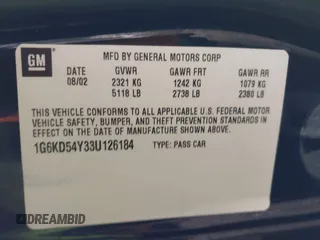 2003 Cadillac DeVille with VIN 1G6KD54Y33U126184, listed as a IAAI auction lot 41385354 with 83,982 mi miles. Bid and sale history available at carsss.com. Image 9.
