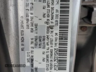 2013 Mazda 2 Touring z VIN JM1DE1LZ5D0162425, wystawiony jako Copart lot #59033595 z przebiegiem 225 932 mil mil oraz Szkoda całkowita • Salvage title. Historia ofert i sprzedaży dostępna na DreamBid. Obrazek 13.