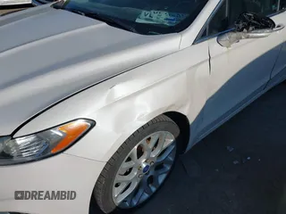 2014 Ford Fusion Titanium with VIN 3FA6P0K95ER128961, listed as a IAAI auction lot 42750668 with 197,188 mi miles and . Bid and sale history available at DreamBid. Image 6.