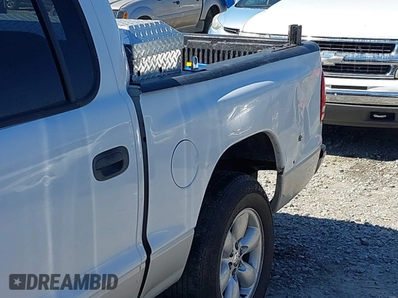 2004 Dodge Dakota SLT with VIN 1D7HL48K54S642754, listed as a IAAI auction lot 41875084 with 242,894 mi miles and . Bid and sale history available at carsss.com. Image 6.