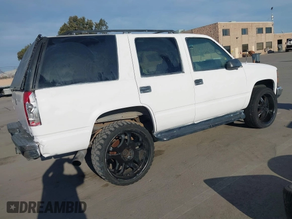 1997 GMC Yukon with VIN 1GKEK13R9VJ741768, listed as a IAAI auction lot 41692027 with 200,681 mi miles. Bid and sale history available at carsss.com. Image 4.
