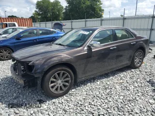 2012 Chrysler 300 Limited z VIN 2C3CCACG9CH173300, wystawiony jako Copart lot #52019775 z przebiegiem 128 492 mil mil oraz Szkoda całkowita • Salvage title. Historia ofert i sprzedaży dostępna na DreamBid. Obrazek 1.