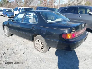 1994 Toyota Camry XLE with VIN JT2GK13E9R0025099, listed as a IAAI auction lot 41735273 with 281,833 mi miles. Bid and sale history available at carsss.com. Image 3.